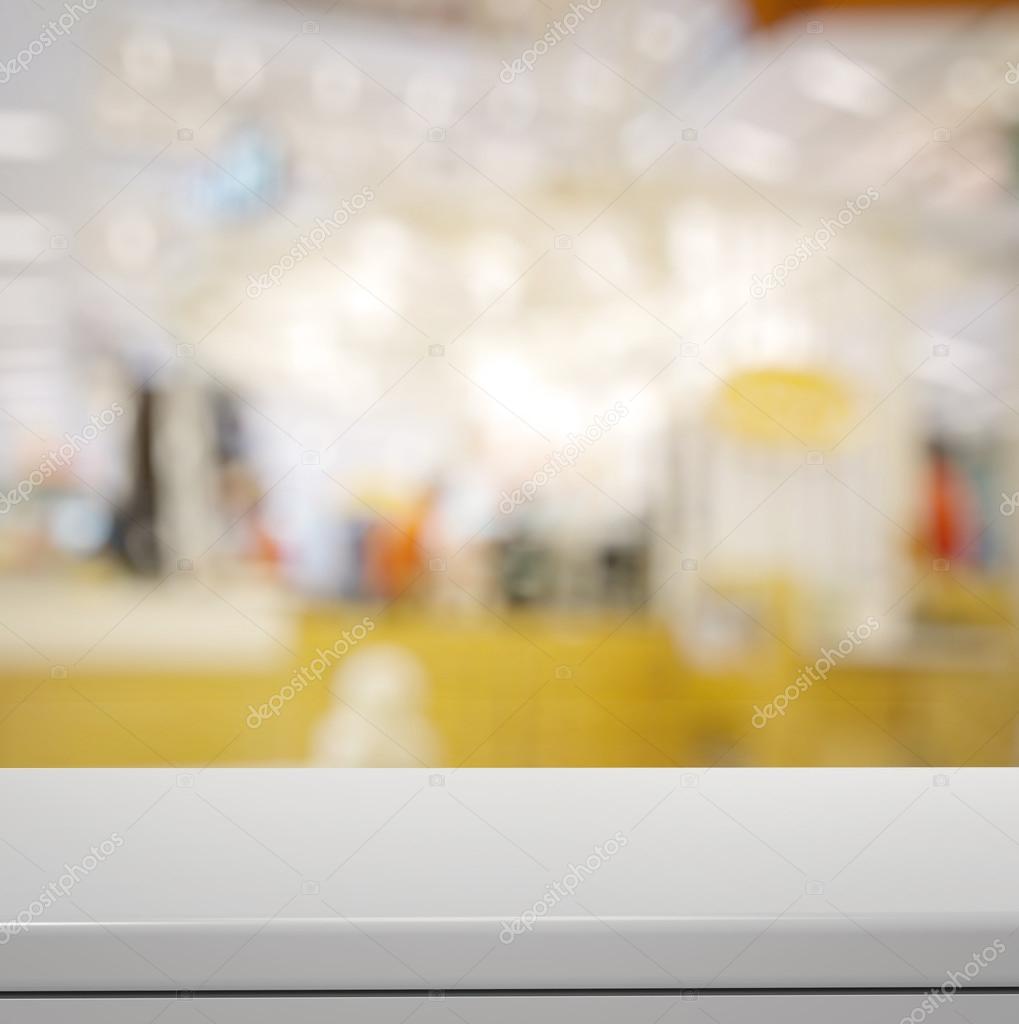 Empty laminate shelf and blurred  background for business produc