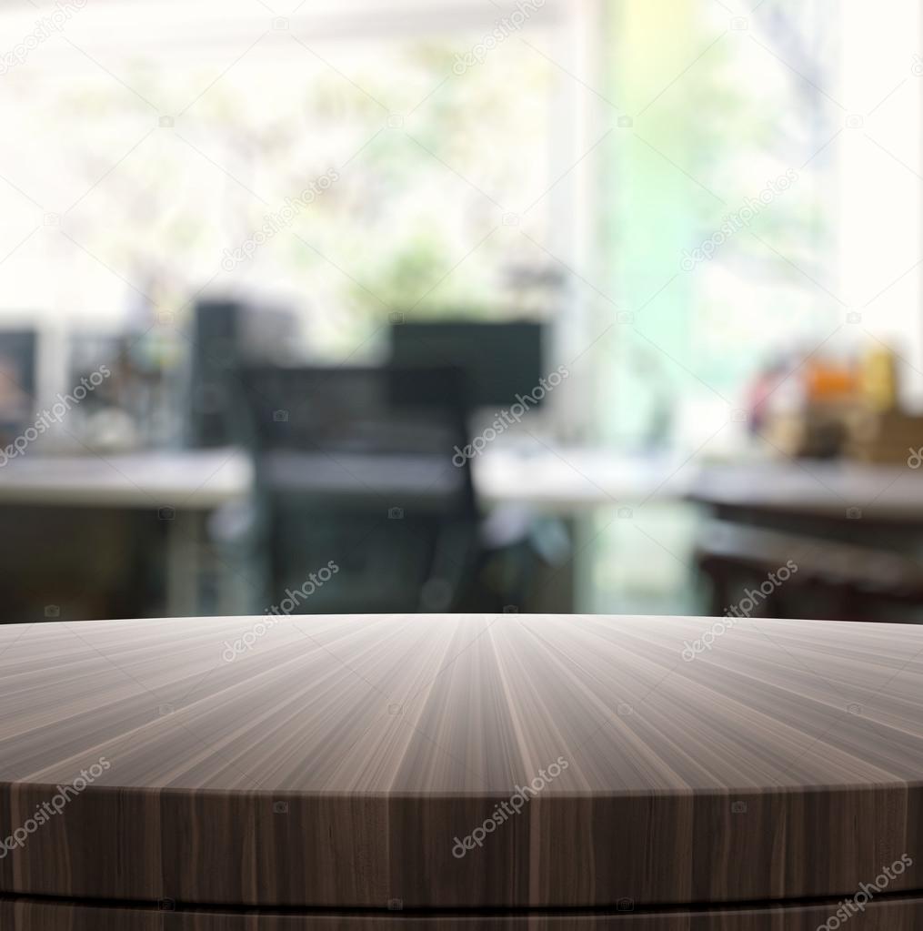 Empty wooden round table and blurred background for product pres