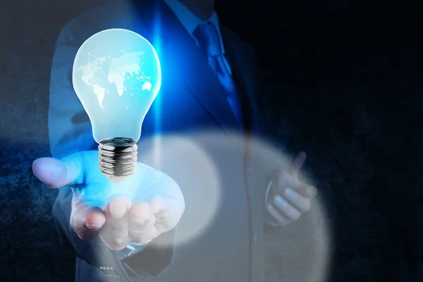 Businessman hand showing light bulb — Stock Photo, Image