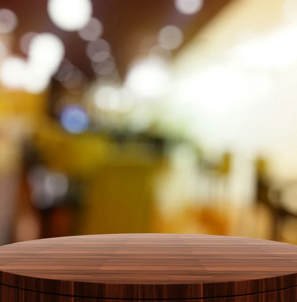 Mesa redonda de madera vacía y fondo borroso para pres producto — Foto de Stock