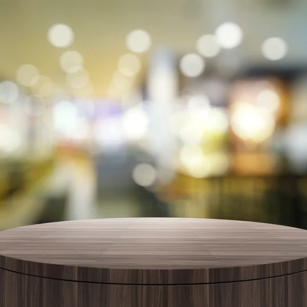 Порожній дерев'яний круглий стіл і розмитий фон для пресету продукту — стокове фото