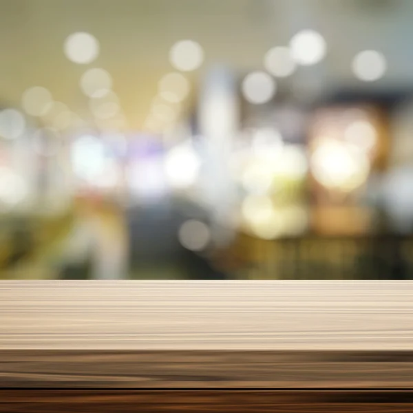 Empty wooden shelf and blurred background for product presentati — Stock Photo, Image