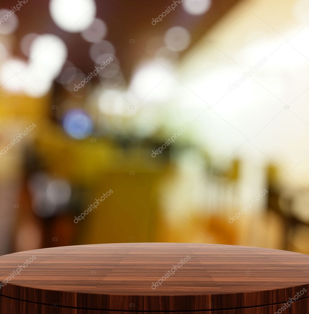 Empty wooden round table and blurred background for product pres