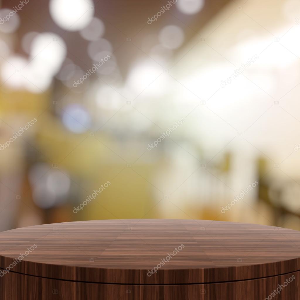 Empty wooden round table and blurred background for product pres