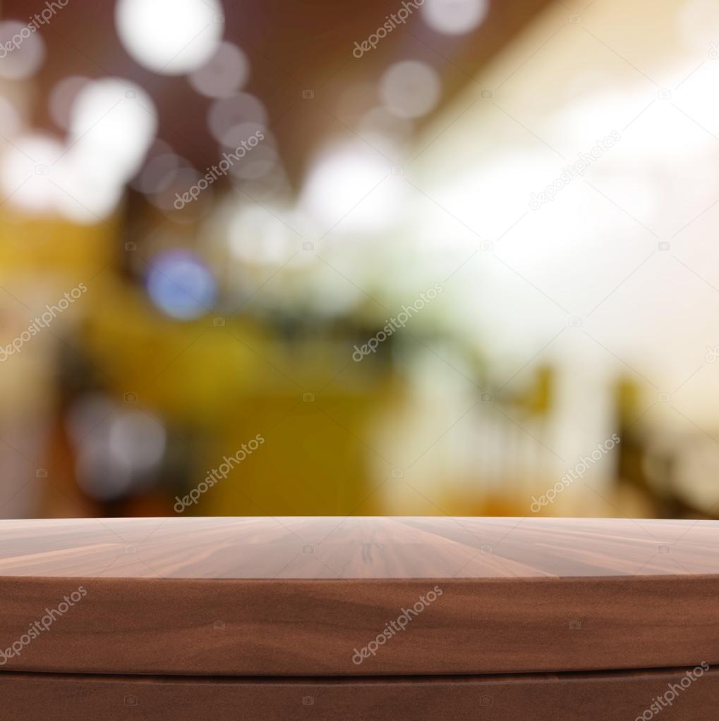 Empty wooden round table and blurred background for product pres