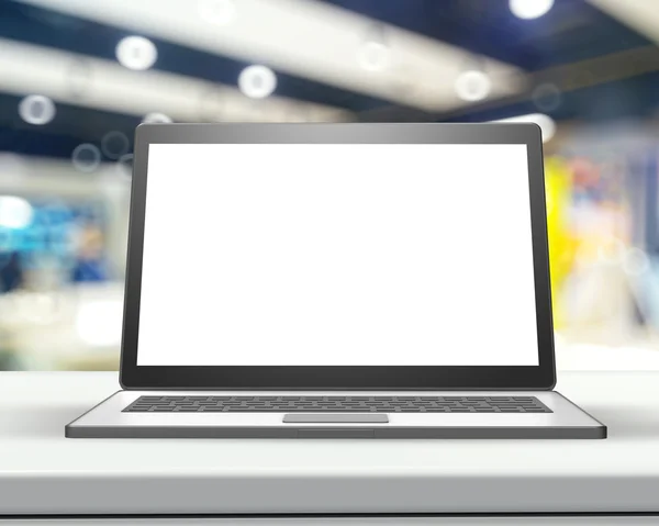 Laptop with blank screen on wood table and blurred background — Stock Photo, Image