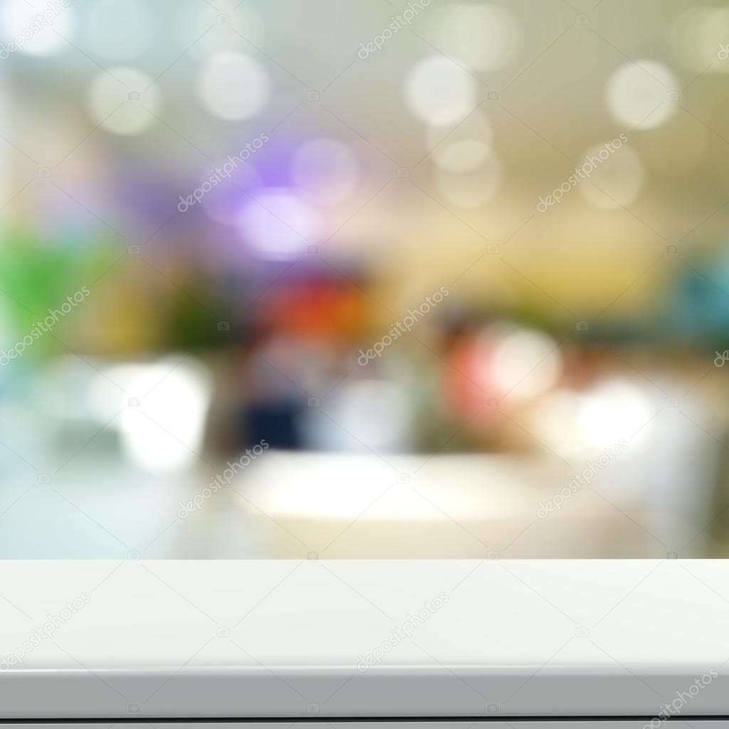 Empty laminate shelf and blurred background for business product