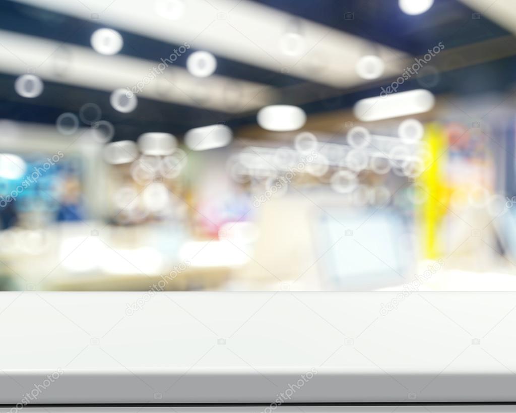 Empty laminate shelf and blurred background for business product