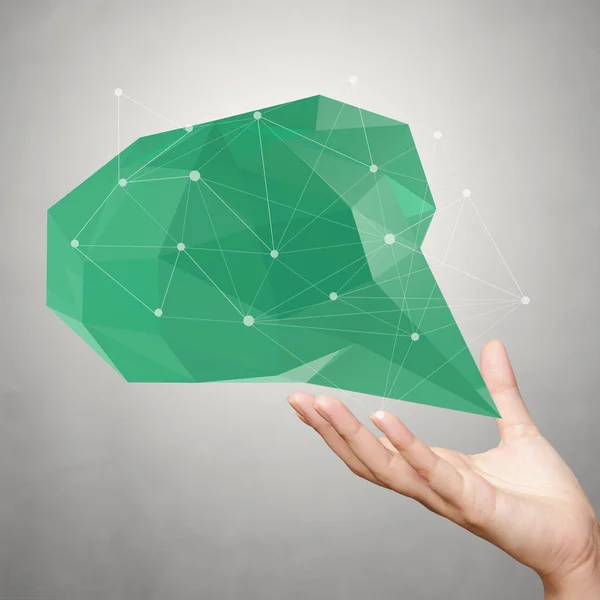 Hand showing low poly geometric speech bubble on white backgroun — Stock Photo, Image