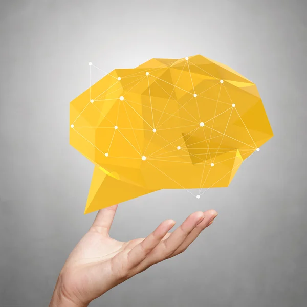 Hand showing low poly geometric speech bubble on white backgroun — Stock Photo, Image