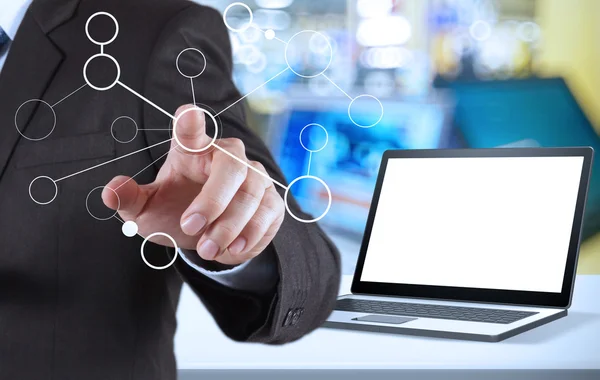 Hand showing blank flow chart and blank laptop computer in shop — Stock Photo, Image