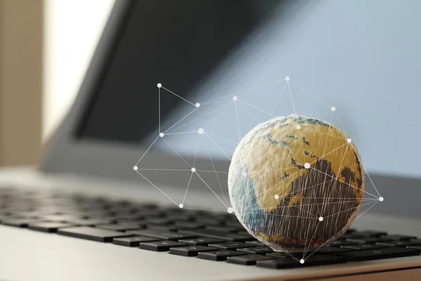 Hand drawn texture globe on laptop computer as internet concept — Stock Photo, Image