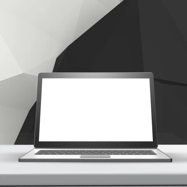Přenosný počítač s prázdnou obrazovkou na laminátovou stůl a nízké poly geometri — Stock fotografie