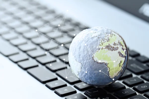 Hand drawn texture globe with social media diagram on laptop com — Stock Photo, Image