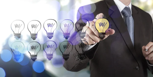 Businessman hand drawing creative business strategy with light b — Stock Photo, Image