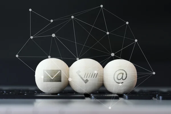 Icon on wooden ball of website and internet contact us page conc — Stock Photo, Image