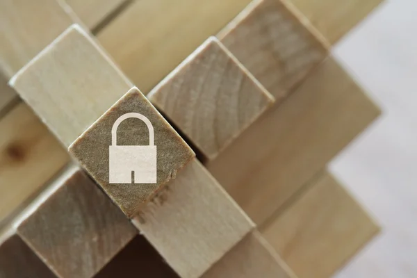 Padlock icon on cubic wood puzzle as internet security online bu — Stock Photo, Image