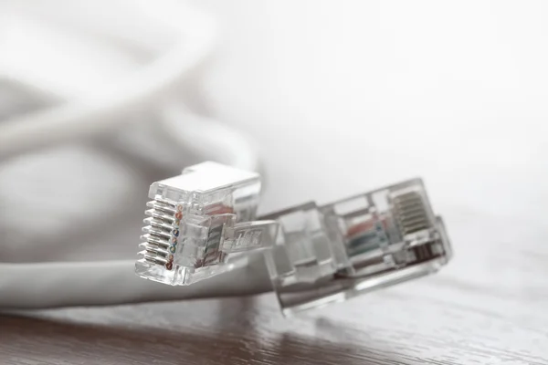 Close up of RJ45 Plug Lan Network on wood desk Stock Picture