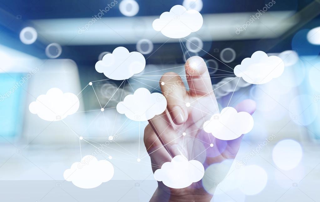 Businessman hand working with a Cloud Computing diagram on the n