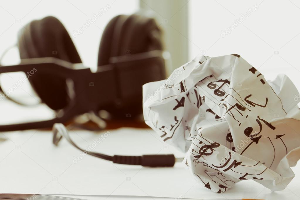 composing music concept with shallow DOF evenly matched crumpled