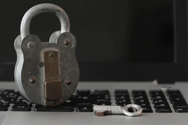 Internet security concept-old key and padlock on laptop computer — Stock Photo, Image