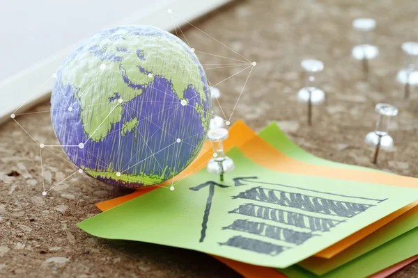 Hand drawn texture globe with pin and business graph sticky note — Stock Photo, Image