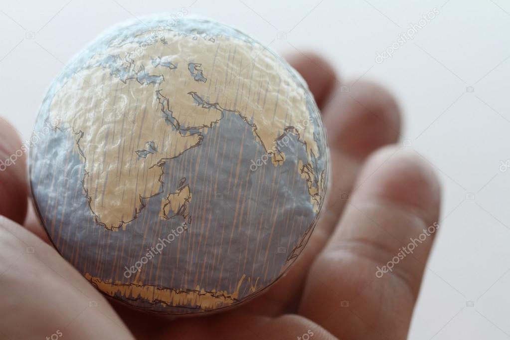 close up of businessman hand showing texture the world concept E