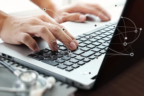 Close up of Doctor hand using laptop computer in office — Stock Photo, Image