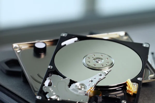 Close up of open computer hard disk drive on notebook — Stock Photo, Image