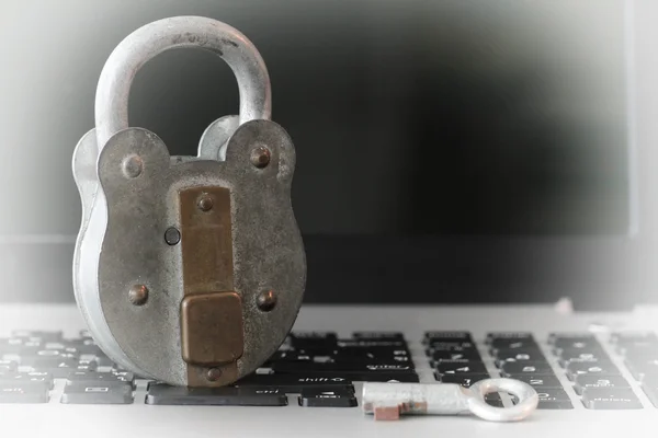 Internet security concept-old padlock and key on laptop computer — Stock Photo, Image