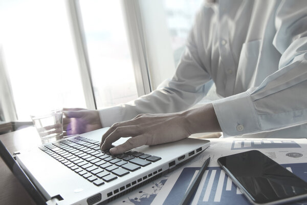 business documents with smart phone on office table and business