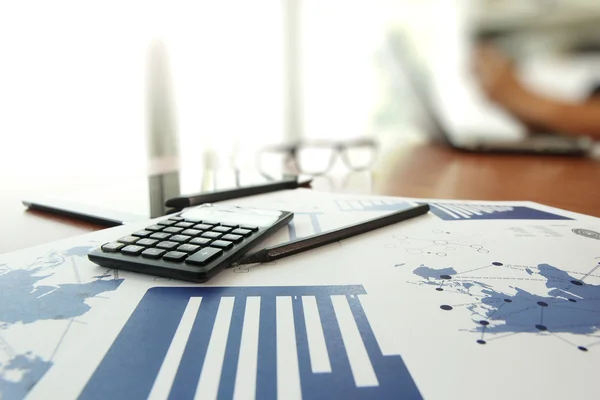 Business documents on office table with calculator and digital t — Stock Photo, Image