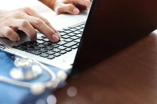 Doctor working with laptop computer in medical workspace office — Stock Photo, Image