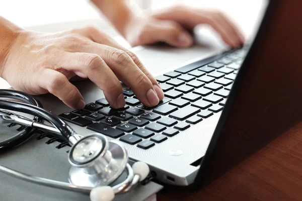 Doctor working with laptop computer in medical workspace office — Stock Photo, Image