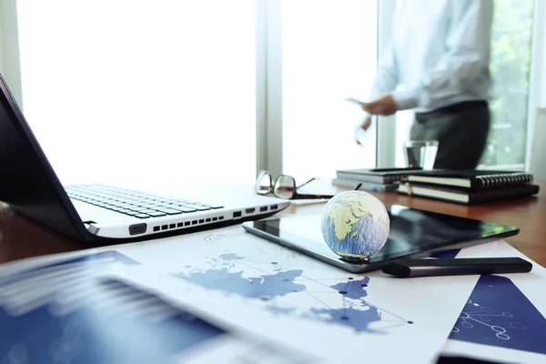 Business documents on office table with texture the world on dig — Stock Photo, Image