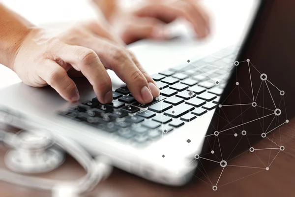 Doctor working with laptop computer in medical workspace office — Stock Photo, Image