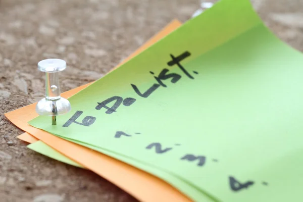 Close up of pin and to do list word on sticky note with cork boa — Stock Photo, Image