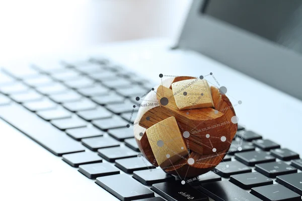 Wooden texture globe with social media diagram on laptop compute — Stock Photo, Image