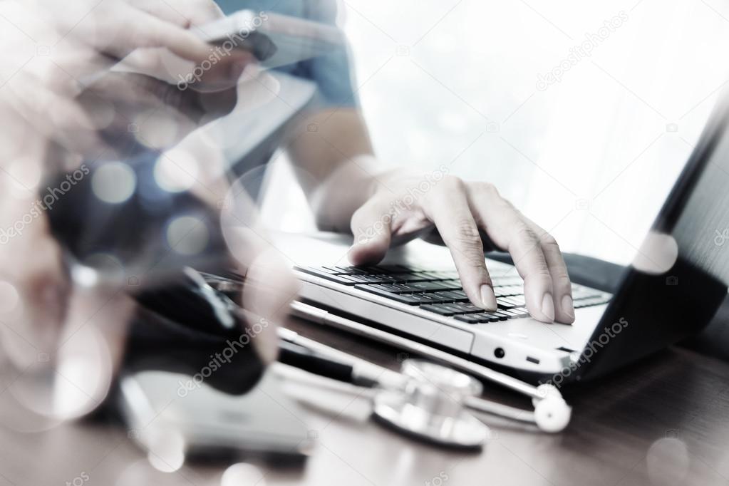 Abstract Image of Doctor working with laptop computer in medical