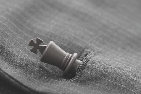 Close up of chess figure on suit background strategy or leadersh — Stock Photo, Image