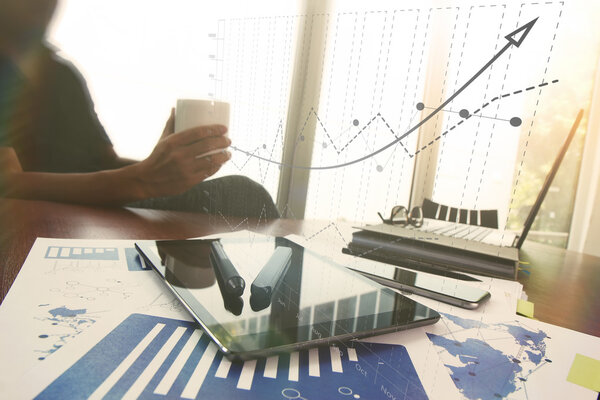 Young creative designer man working at office and social network