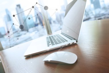 mouse and laptop computer is on wooden desk as workplace concept