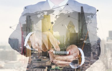 Double exposure of success businessman using smart phone with ab
