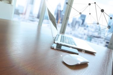mouse and laptop computer is on wooden desk as workplace concept