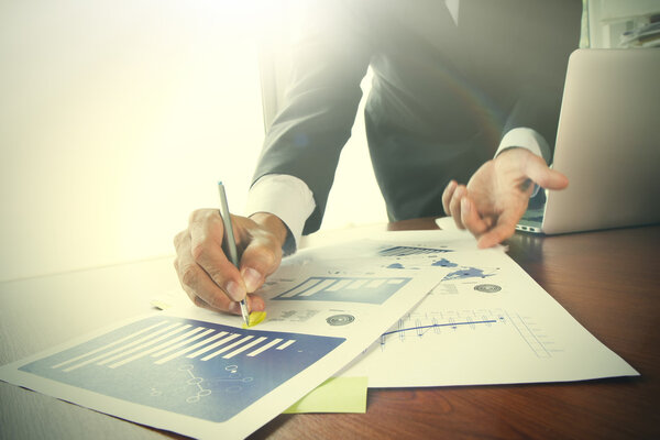 business documents on office table with smart phone and digital 