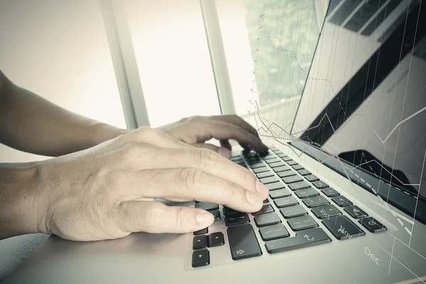 Close up of business man hand working on laptop computer with bu — Stock Photo, Image