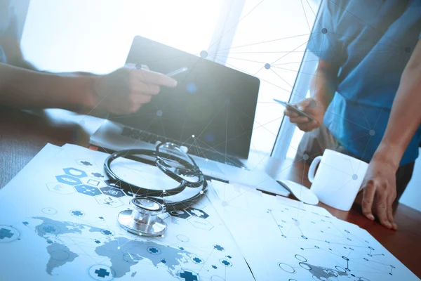 Team doctor working with laptop computer in medical workspace of — Stock Photo, Image