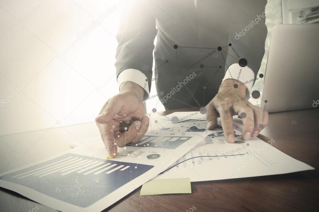 businessman hand working with business documents on office table