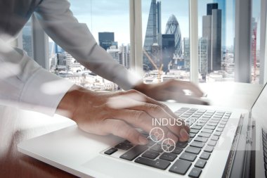 Double exposure of business engineer draw icon of industry and a