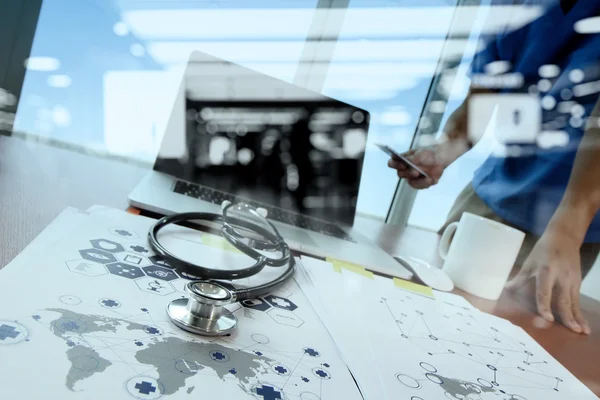 Doctor working with digital tablet and laptop computer in medica — Stock Photo, Image